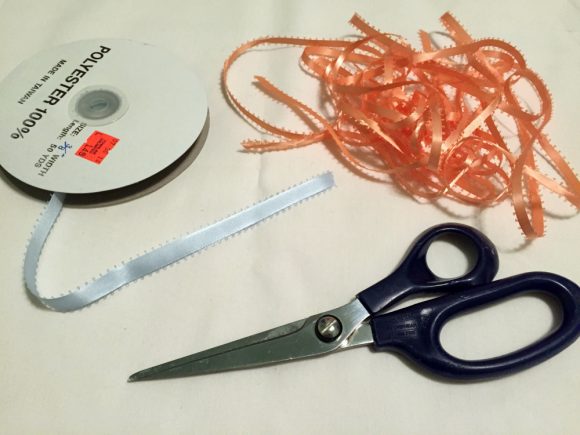 You can use new ribbon to make this fringe garland or bust your stash. The trick is in how you tie the knots.