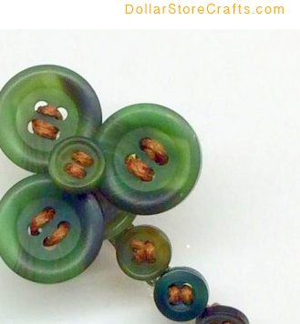 DIY Shamrock Pin - Dig into your button jar and try this great stashbusting project; once you master the technique, you can also use it to make all kinds of other shapes as well!