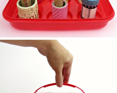 Make a DIY washi tape organizer from a cupcake carrier and free coin rolls from the bank.