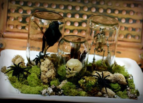Make Halloween terrariums from recycled jars and dollar store halloween decorations