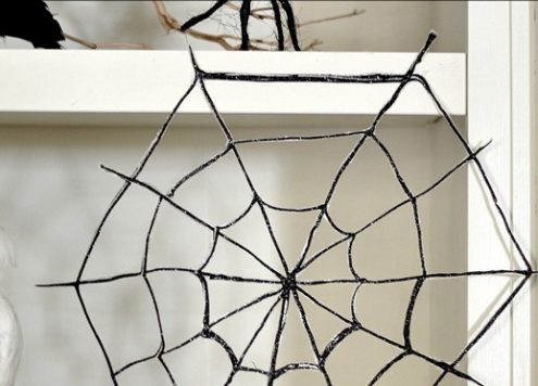 Make glitter spider webs (via dollarstorecrafts.com)