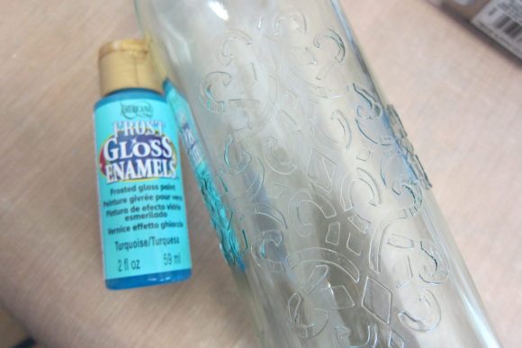 Make a Faux Sea Glass Bottle - Sea glass is still so popular, and it's a beautiful way to decorate your home in the summer.  Rather than buying new decorative accents, you can make your own using a few simple items plus recyclables.  