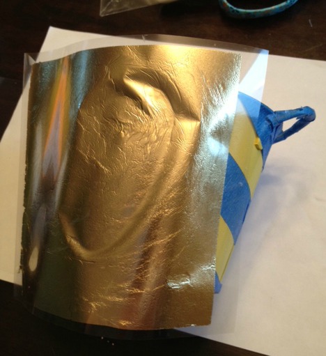 Applying gold leaf